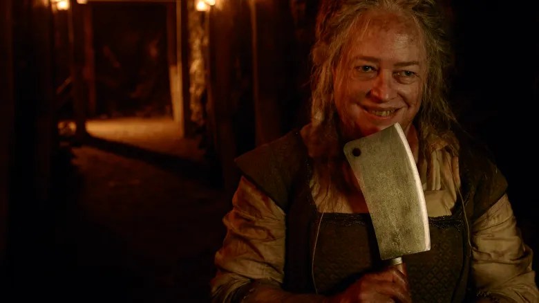 Agnes (Kathy Bates) holding a knife, believing she's the Butcher